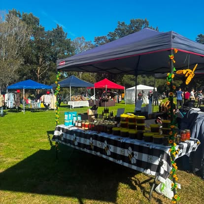 The Honey Beeluxe market stall under a gazebo
